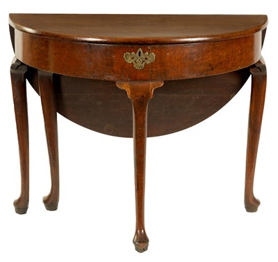 Lot 849 - AN GEORGE II CIRCULAR OAK DROP LEAF SIDE TABLE