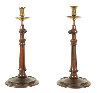 Lot 484 - AN UNUSUAL PAIR OF LATE REGENCY ROSEWOOD AND GILT BRASS ADJUSTABLE CANDLESTICKS