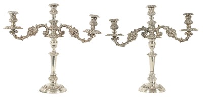 Lot 305 - A LARGE PAIR OF GEORGE IV SHEFFIELD PLATE TWO BRANCH CANDELABRA