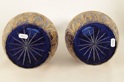 Lot 9 - A LARGE PAIR OF 19TH CENTURY BOHEMIAN CUT GILT AND BRISTOL BLUE SERVING BOTTLES