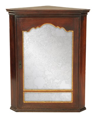 Lot 855 - A GEORGE II WALNUT HANGING CORNER CUPBOARD