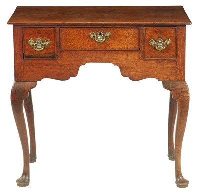 Lot 1335 - A GEORGE III OAK LOWBOY