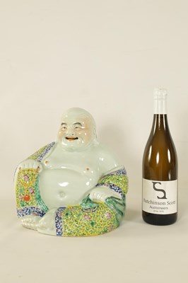Lot 217 - A LATE 19TH CENTURY CHINESE POLYCHROME SEATED FIGURE OF A HOTEI