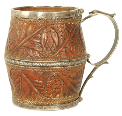 Lot 292 - A GEORGE III SILVER MOUNTED COCONUT TANKARD