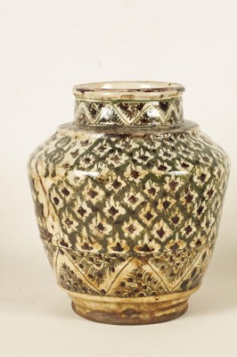 Lot 110 - AN EARLY PERSIAN GLAZED EARTHENWARE SHOULDERED VASE