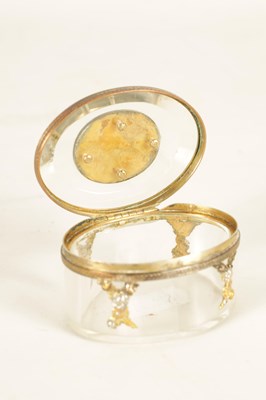 Lot 221 - A 19TH CENTURY FRENCH OVAL GLASS AND GILT METAL MOUNTED PATCH BOX