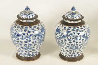 Lot 92 - A LARGE PAIR OF 19TH CENTURY CHINESE BLUE AND WHITE CRACKLE GLAZE SHOULDERED VASES AND COVERS