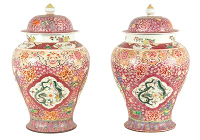 Lot 169 - A PAIR OF 19TH CENTURY CHINESE PINK GROUND TAPERING SHOULDERED VASES WITH DOMED COVERS