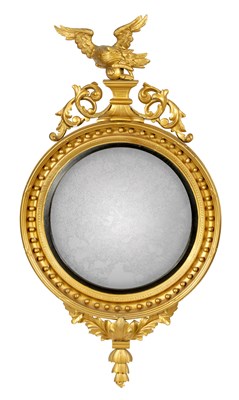 Lot 874 - A LARGE REGENCY CARVED GILT WOOD CONVEX HANGING MIRROR