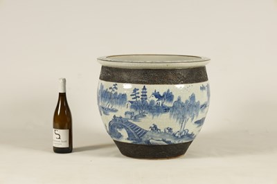 Lot 178 - A 19TH CENTURY CHINESE CRACKLE GLAZE BLUE AND WHITE JARDINIERE