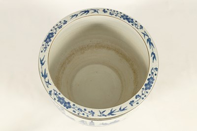 Lot 178 - A 19TH CENTURY CHINESE CRACKLE GLAZE BLUE AND WHITE JARDINIERE