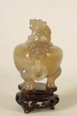 Lot 130 - A CHINESE AGATE KORO AND COVER ON STAND