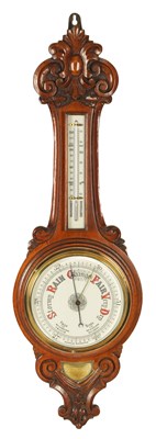 Lot 1002 - A LATE 19TH CENTURY OAK ANEROID WHEEL BAROMETER