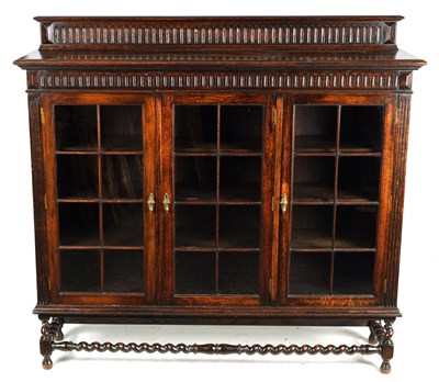 Lot 1234 - AN EARLY 20TH CENTURY OAK DISPLAY CABINET