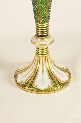 Lot 10 - A 19TH CENTURY GREEN GLASS AND WHITE OVERLAY GILT VASE