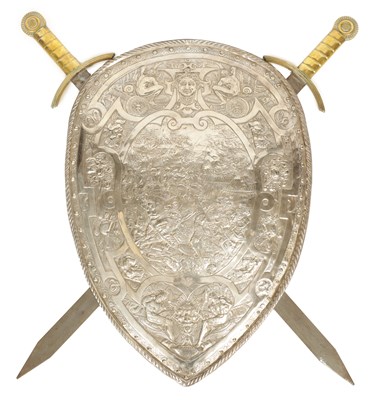 Lot 1142 - AN EARLY 20TH CENTURY WALL MOUNTED SILVER-PLATED SHIELD AND CROSS SWORDS