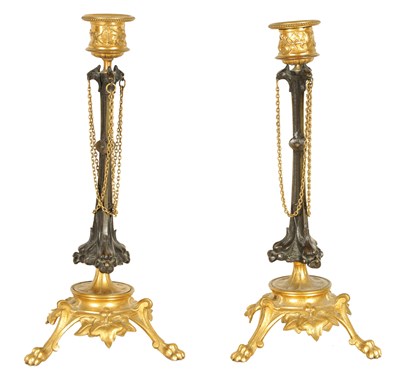 Lot 891 - A PAIR OF LATE 19TH CENTURY FRENCH BARBIDIENNE STYLE BRONZE AND ORMOLU CANDLESTICKS