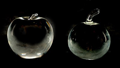 Lot 1257 - TWO CLEAR GLASS PAPERWEIGHTS ONE BY CARTIER AND THE OTHER BY TIFFANY & CO