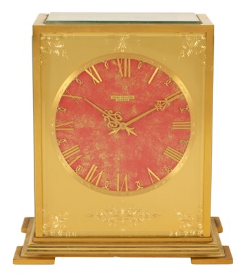 Lot 689 - PATEK PHILLIPE. A MID 20TH CENTURY GILT BRASS SOLAR POWERED TABLE CLOCK