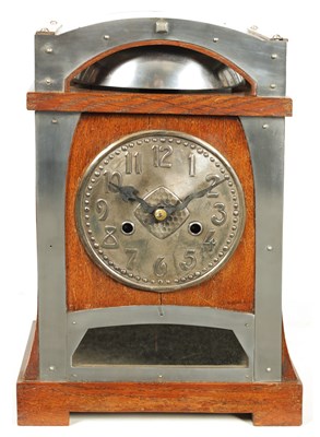 Lot 805 - AN ARTS AND CRAFTS HAMBURG AMERICAN COMPANY OAK AND NICKEL MOUNTED MANTEL CLOCK