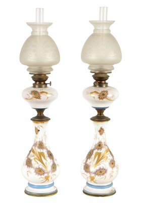 Lot 1428 - A PAIR OF FRENCH 19TH CENTURY OPALINE GLASS AND BRASS MOUNTED OIL LAMPS