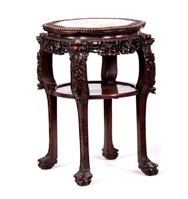 Lot 120 - A 19TH CENTURY PROFUSELY CARVED CHINESE HARDWOOD CIRCULAR JARDINIERE STAND