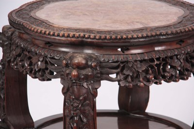 Lot 212 - A 19TH CENTURY PROFUSELY CARVED CHINESE HARDWOOD CIRCULAR JARDINIERE STAND