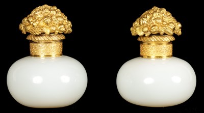 Lot 793 - A PAIR OF EARLY 19TH CENTURY FRENCH ORMOLU MOUNTED WHITE OPALINE GLASS PERFUME BOTTLES