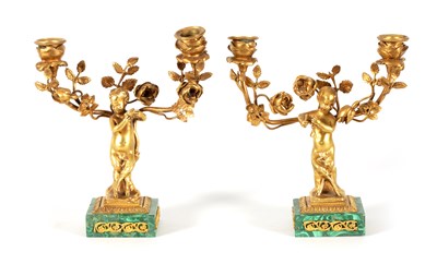 Lot 678 - A PAIR OF EARLY 20TH CENTURY TWO BRANCH GILT BRONZE AND MALACHITE CANDELABRA