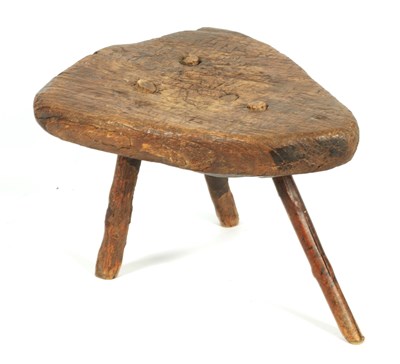 Lot 1102 - AN EARLY PRIMITIVE ELM STOOL