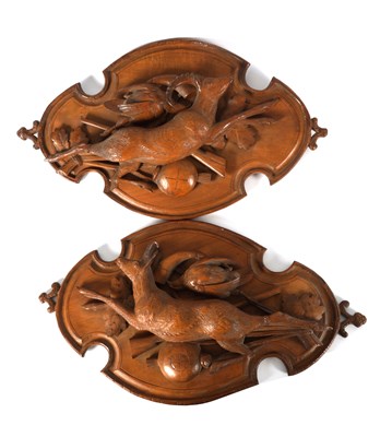 Lot 592 - A PAIR OF LATE 19TH CENTURY BLACK FOREST CARVED  LINDEN WOOD PLAQUES