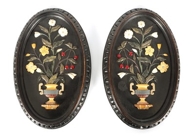 Lot 677 - A PAIR OF 19TH CENTURY ITALIAN BLACK SLATE AND PIETRA DURA SLENDER OVAL HANGING PLAQUES