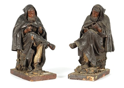 Lot 721 - A PAIR OF EARLY PRESSED LEATHER CREICHE SEATED FIGURES