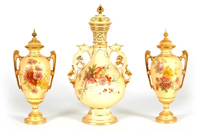 Lot 77 - AN ORNATE ROYAL WORCESTER GILT AND IVORY GROUND SCROLLED TWO-HANDLED CABINET VASE AND COVER
