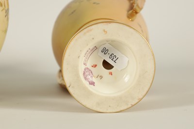 Lot 52 - AN ORNATE ROYAL WORCESTER GILT AND IVORY GROUND SCROLLED TWO-HANDLED CABINET VASE AND COVER