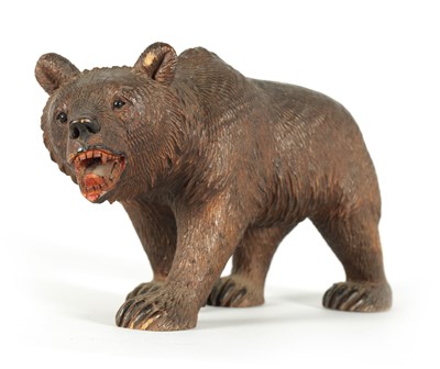 Lot 603 - AN EARLY 20TH CENTURY CARVED BLACK FOREST BEAR