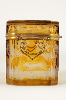 Lot 14 - A 19TH CENTURY BOHEMIAN AMBER GLASS OVERLAY CASKET