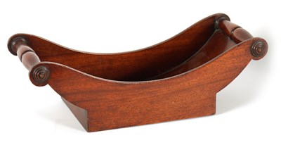 Lot 579 - A GEORGIAN BOAT SHAPED MAHOGANY CHEESE COASTER