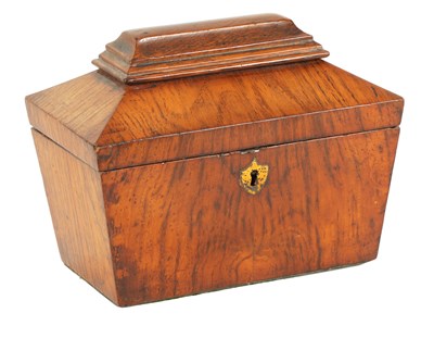 Lot 555 - A LATE REGENCY FIGURED OAK SARCOPHAGUS SHAPED TEA CADDY