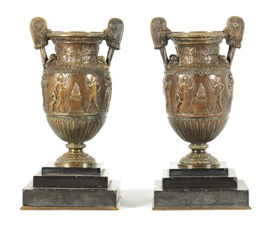 Lot 752 - A PAIR OF 19TH CENTURY FRENCH BRONZE ROMANESQUE TWO-HANDLED URNS