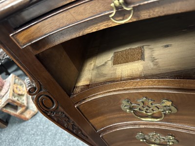 Lot 1130 - A GEORGE III FLAME MAHOGANY SERPENTINE CHEST OF DRAWERS
