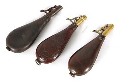 Lot 386 - A COLLECTION OF THREE 19TH CENTURY LEATHER POWDER FLASKS