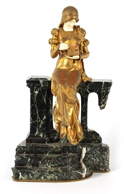 Lot 731 - A LATE 19TH CENTURY ART NOUVEAU GILT BRONZE AND IVORY FIGURE OF A SEATED YOUNG LADY