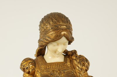 Lot 731 - A LATE 19TH CENTURY ART NOUVEAU GILT BRONZE AND IVORY FIGURE OF A SEATED YOUNG LADY