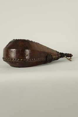 Lot 788 - A 19TH CENTURY LEATHER AND BRASS STUDDED HARVEST FLASK