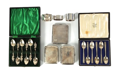 Lot 345 - TWO BOXED COLLECTIONS OF SIX SILVER TEASPOONS, THREE SILVER CIGARETTE CASES AND THREE SILVER NAPKIN RINGS