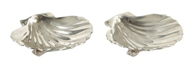 Lot 371 - A NEAR PAIR OF ELIZABETH II IRISH SILVER SCALLOP DISHES