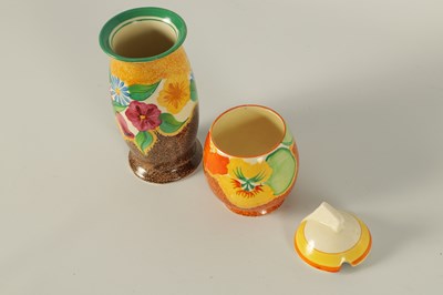 Lot 35 - TWO PIECES OF 1930’S CLARICE CLIFF ‘BIZARRE’ CERAMIC POTTERY COMPRISING OF A PRESERVE POT HAND DECORATED IN THE NASTURTIUM PATTERN AND A BULBOUS SPILL VASE DECORATED IN THE ‘PETUNIA’ PATTERN