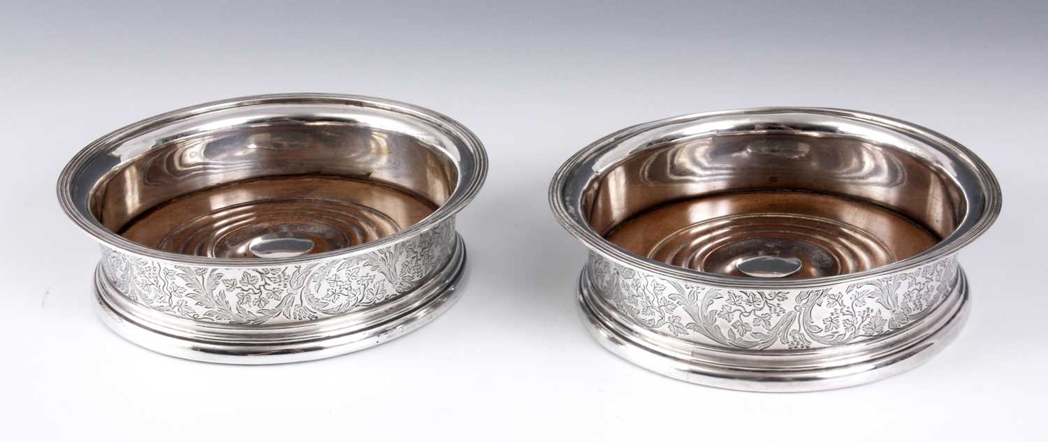 Lot 255 - A PAIR OF GEORGE III SILVER WINE COASTERS with...