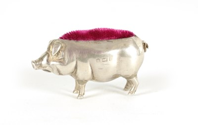 Lot 361 - A SMALL EDWARDIAN SILVER PIN CUSHION IN THE FORM OF A PIG